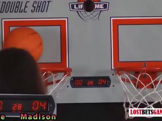 Two adorable girls play a game of strip basketball shootout