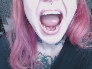 Pink haired girl holds mouth wide open for you ;)