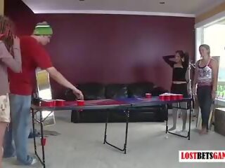 Three Girls and One Guy Play a Game of Strip Beer Pong