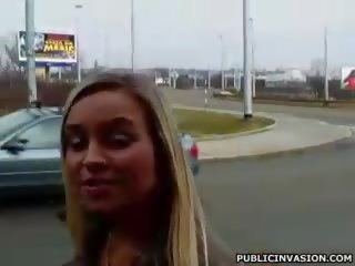 Busty tanned blonde gives meaty cock a blowjob in public